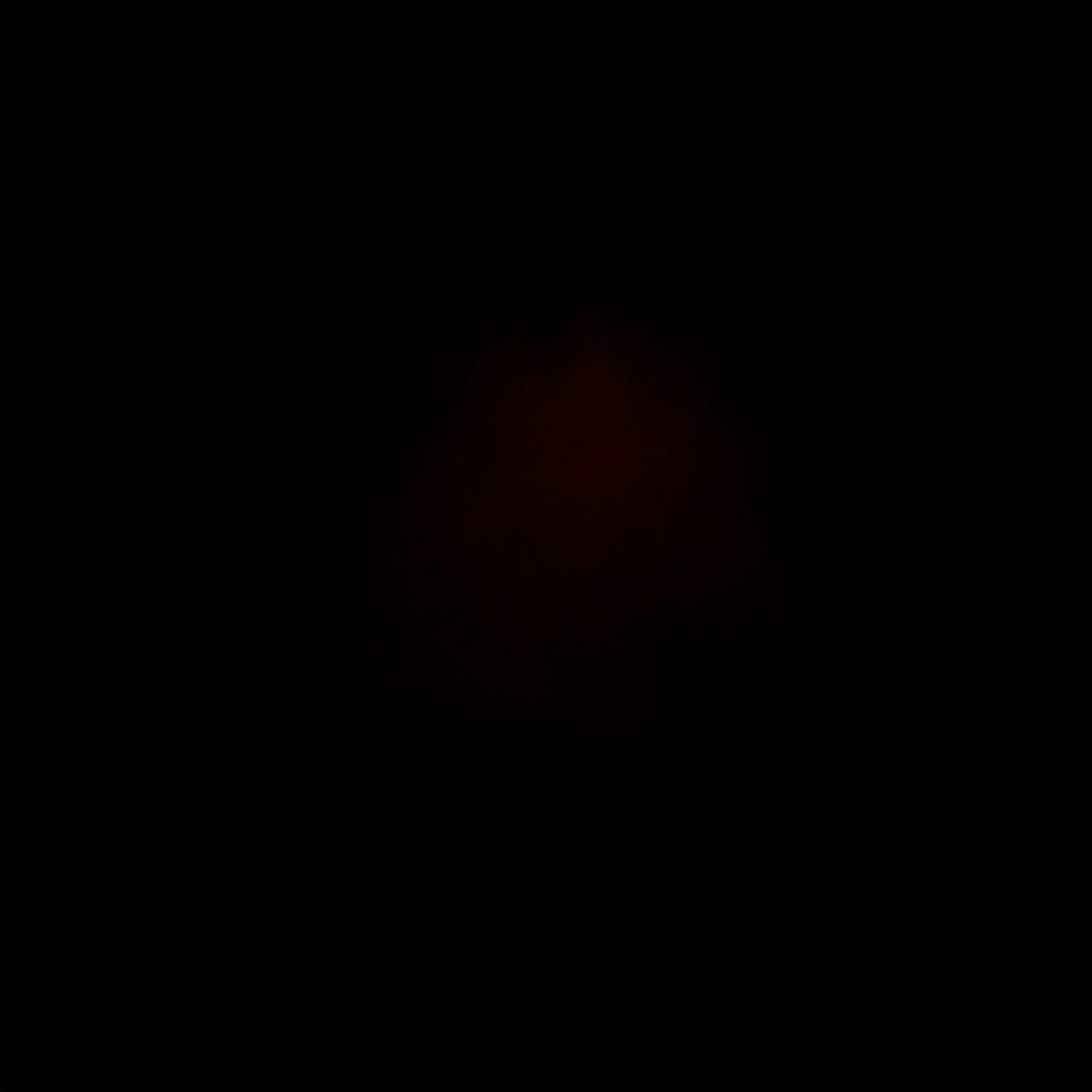 A low-key moody photograph of VR controllers resting in shadow with faint orange accent light